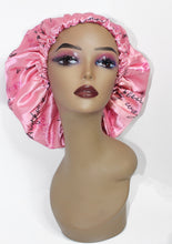 Load image into Gallery viewer, Light Pink Satin Bonnet. Contains Self-Affirmations written in slight cursive black writing. Self-Affirmations say things like &quot;Anything is possible&quot; &quot;My failures are a part of my journey to success&quot; &quot;I am enough&quot; &quot;I am royal&quot; etc.